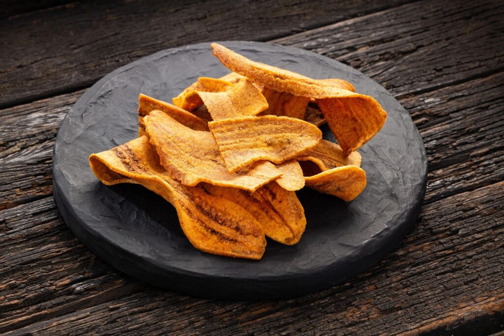 banana chips artisan snack dark background gold accent